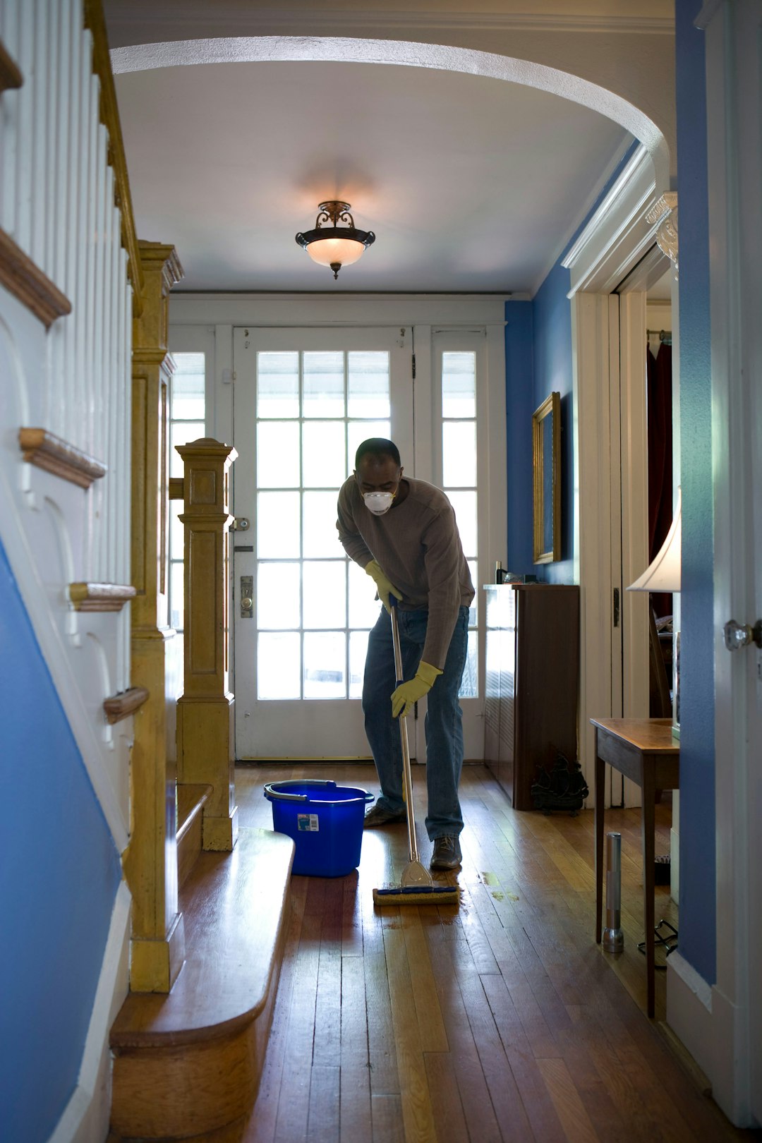 cta-bg This African-American man was in the process of damp-mopping his home’s entrance way. In this way airborne particulates including dust and pollen, could be removed from the inside of his home, thereby, reducing the detrimental effects these substances have upon the respiratory system of his family members. These irritants can sometimes result in sinus infections, and asthma.